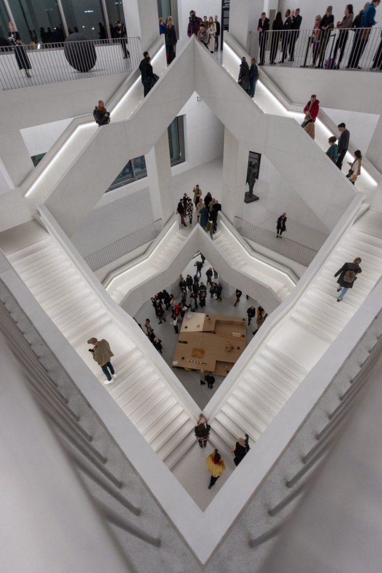 People are seen on the main staircase of the new building of the Museum of Modern Art in Warsaw, Poland on the night of opening October 25, 2024. (Photo by Wojtek RADWANSKI / AFP) (Photo by WOJTEK RADWANSKI/AFP via Getty Images)