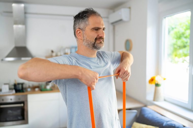 Man exercising at home.
