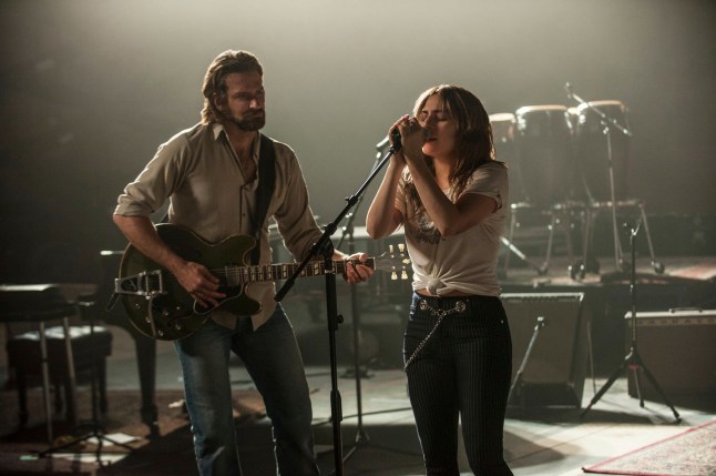 This image released by Warner Bros. shows Bradley Cooper, left, and Lady Gaga in a scene from the latest reboot of the film, 