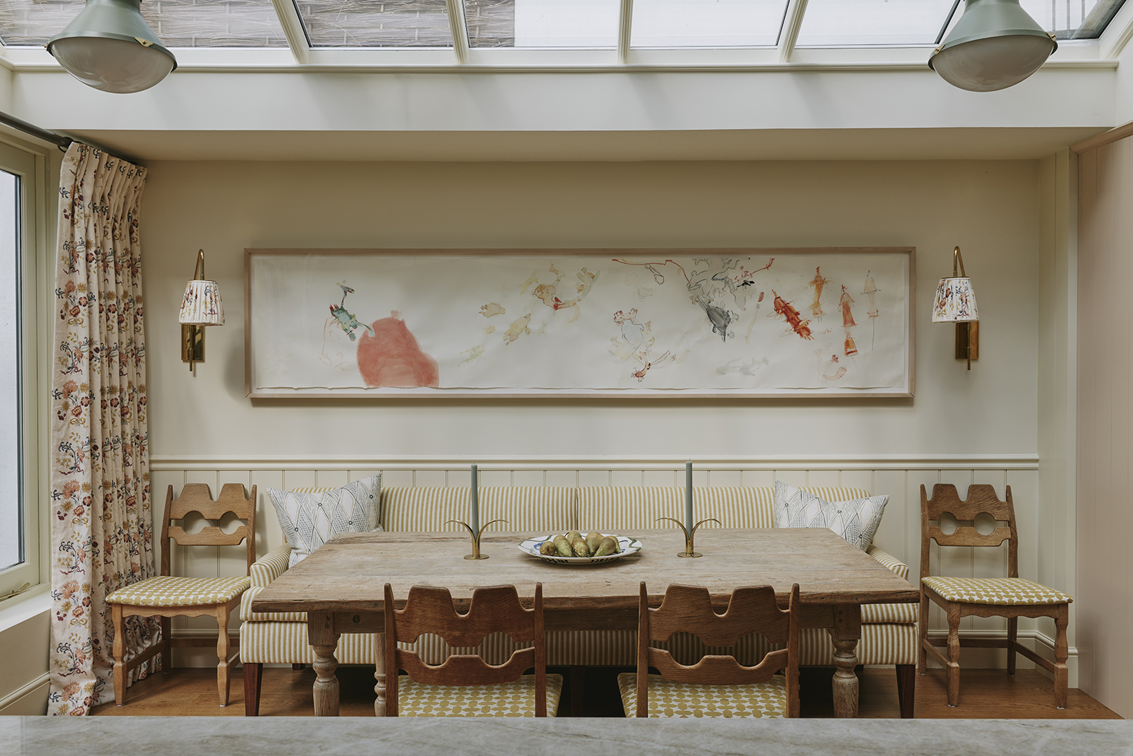 dining banquette with large art