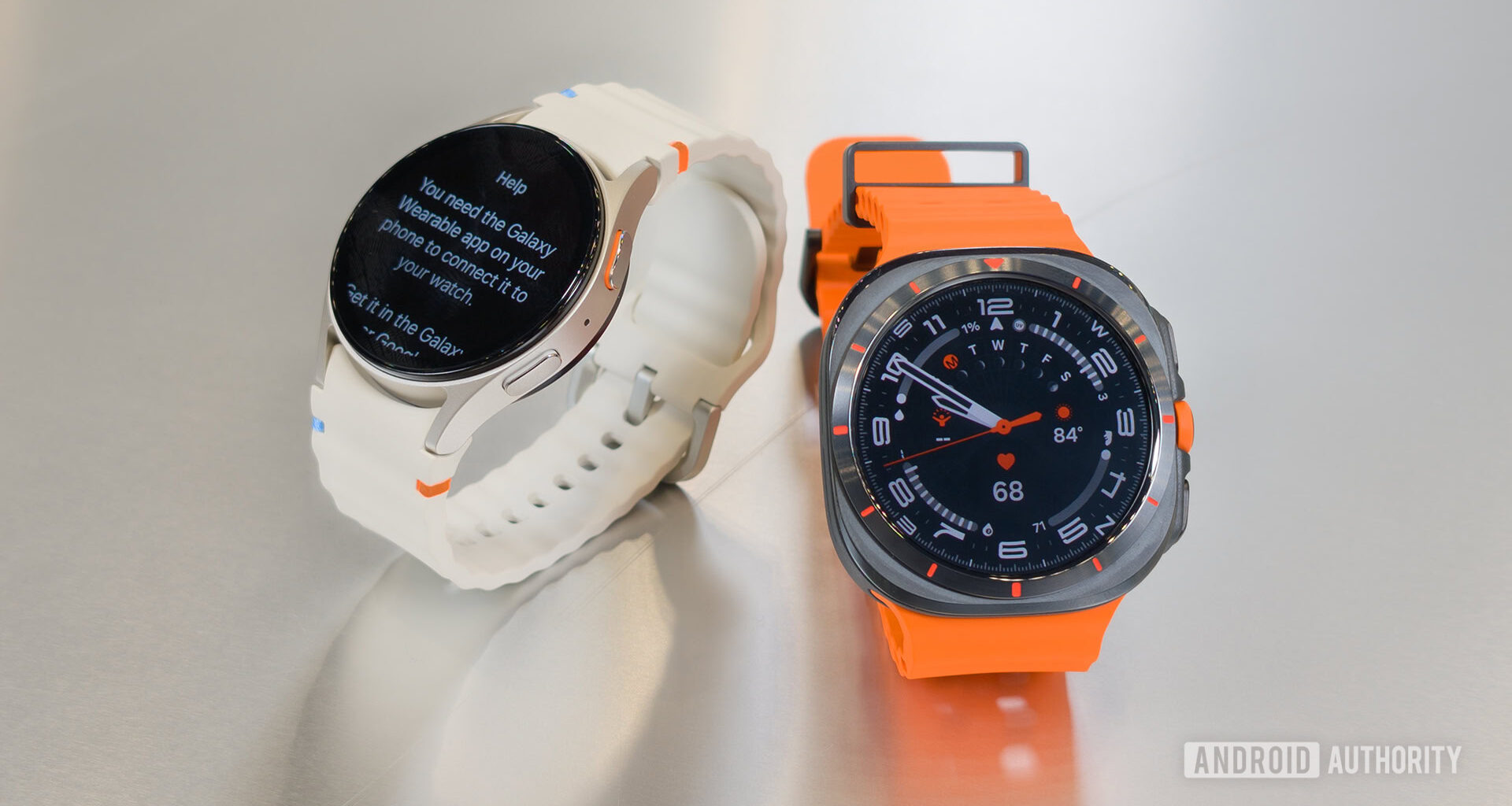 Samsung Galaxy Watch Ultra and Samsung Galaxy Watch 7 on Table Next to Each Other