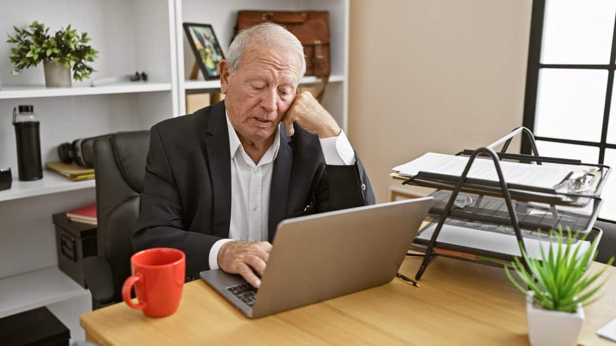 Older man working at desk