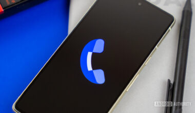 Stock photo of Phone by Google app on phone next to home phone agenda and pen 2