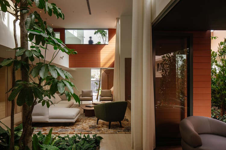 In-Between House / Super Assembly - Interior Photography, Living Room, Courtyard