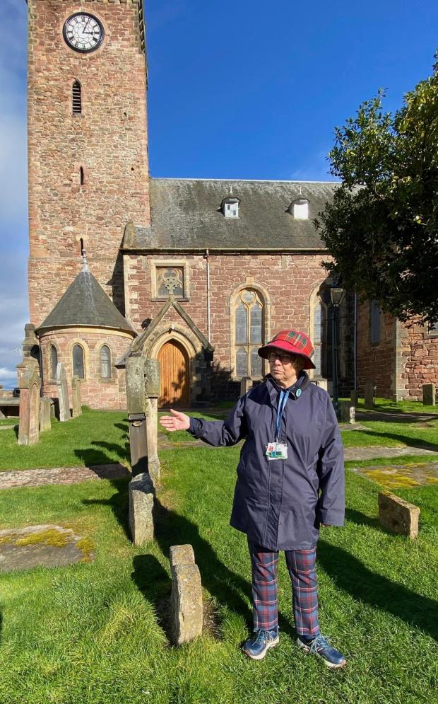 Tour guide Cath Findlay appears in the Old High Church Kirkyard