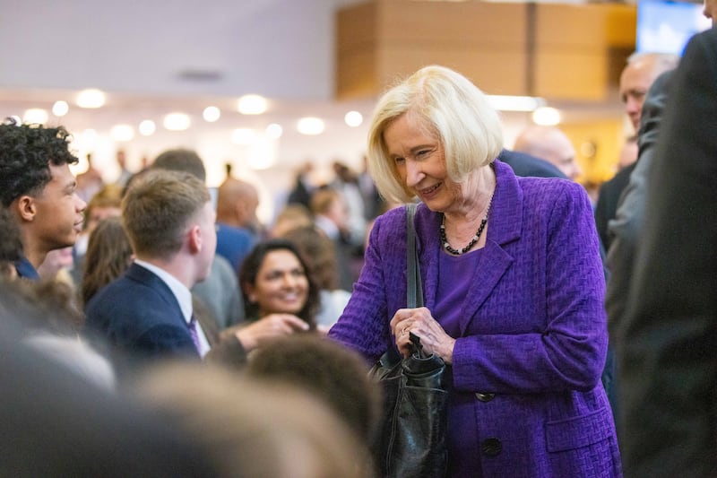 Sister Mary Cook, wife of Elder Quentin L. Cook of the Quorum of the Twelve Apostles, greets attendees of a multi-stake conference held in Birmingham, England on Sunday, May 25, 2025.