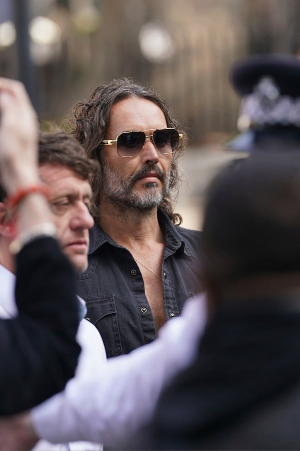 Russell Brand arrives at Westminster Magistrates' court in London, Friday, May 2, 2025, where he faces, rape and sexual assault charges involving four women. (AP Photo/Alberto Pezzali)