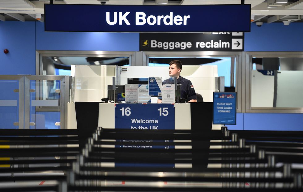 A member of the military at passport control at Manchester airport as they cover for striking Border Force officers