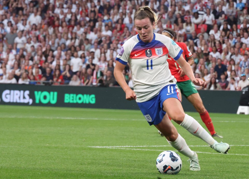 Lauren Hemp of England and Ines Pereira of Portugal competing for the ball during a soccer match.