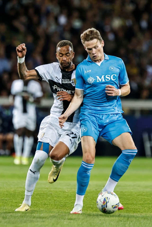 Scott McTominay of Napoli in action against Parma's Junior Hernani during a Serie A match.