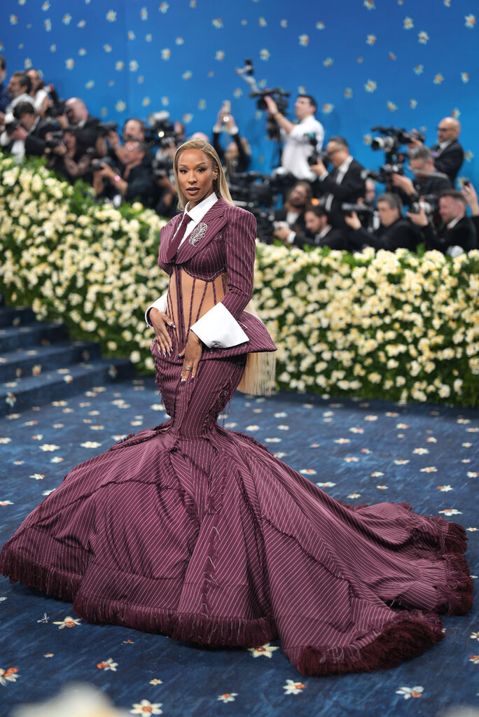 Savannah James wearing a maroon gown.