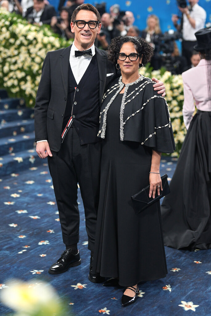  Carl Wennerlind, wearing a black suit, and Monica L. Miller, wearing a black dress with an embroidered black cape.