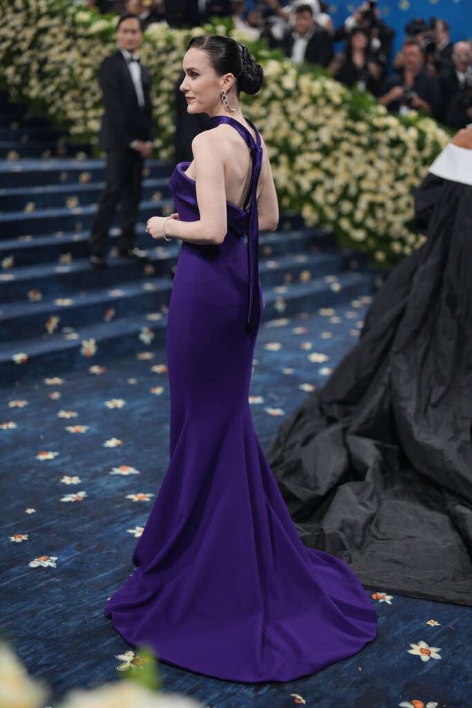 Rachel Brosnahan wearing a long purple dress.