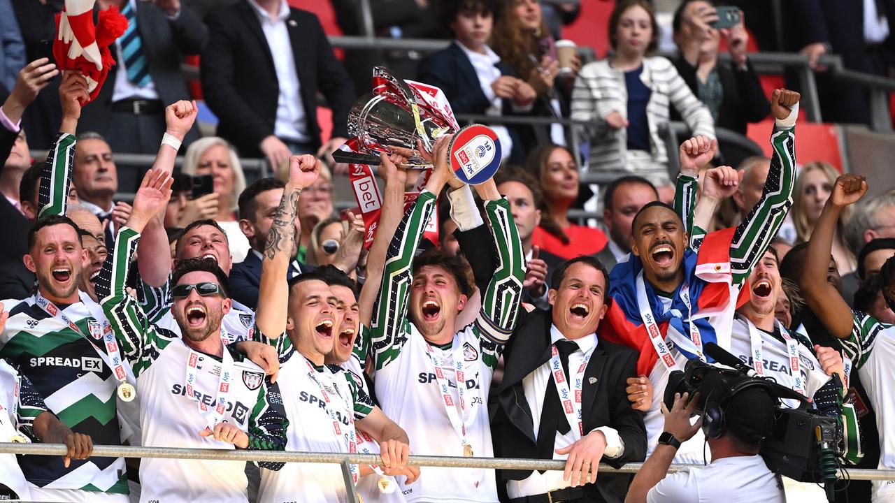 LONDON, ENGLAND - MAY 24: Dan Neil of Sunderland lifts The Sky Bet Championship Play-Off trophy after his team's victory and subsequent promotion to the Premier League.