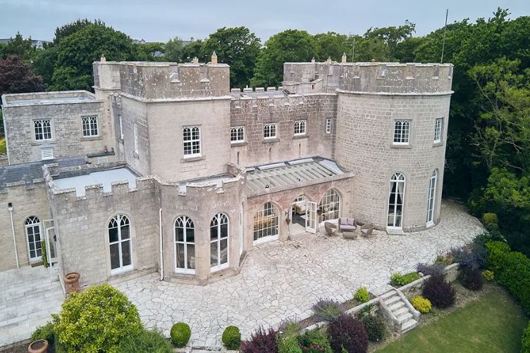 UK castle that costs less than a hotel stay in London with indoor swimming pool, tropical gardens and private beach