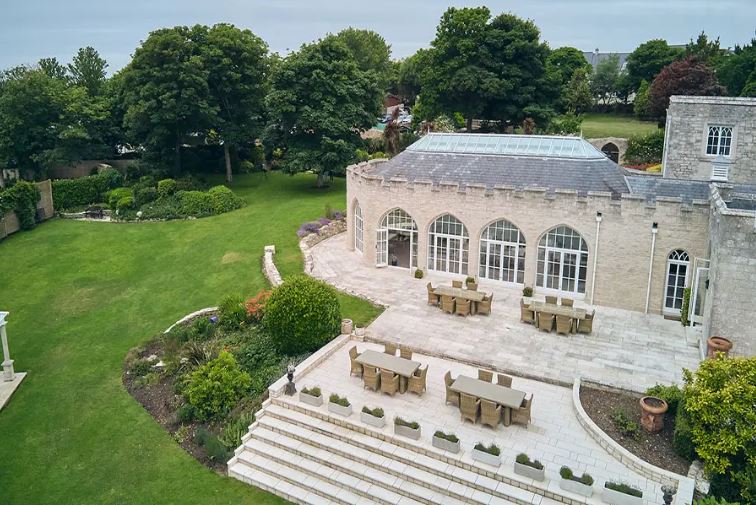 Aerial view of Wyatt Castle and its expansive patio and gardens.