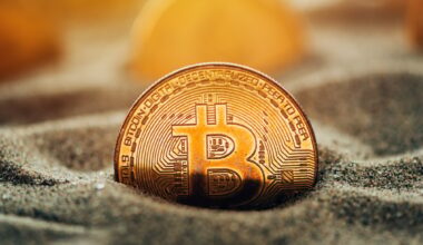 Bitcoins in sand
