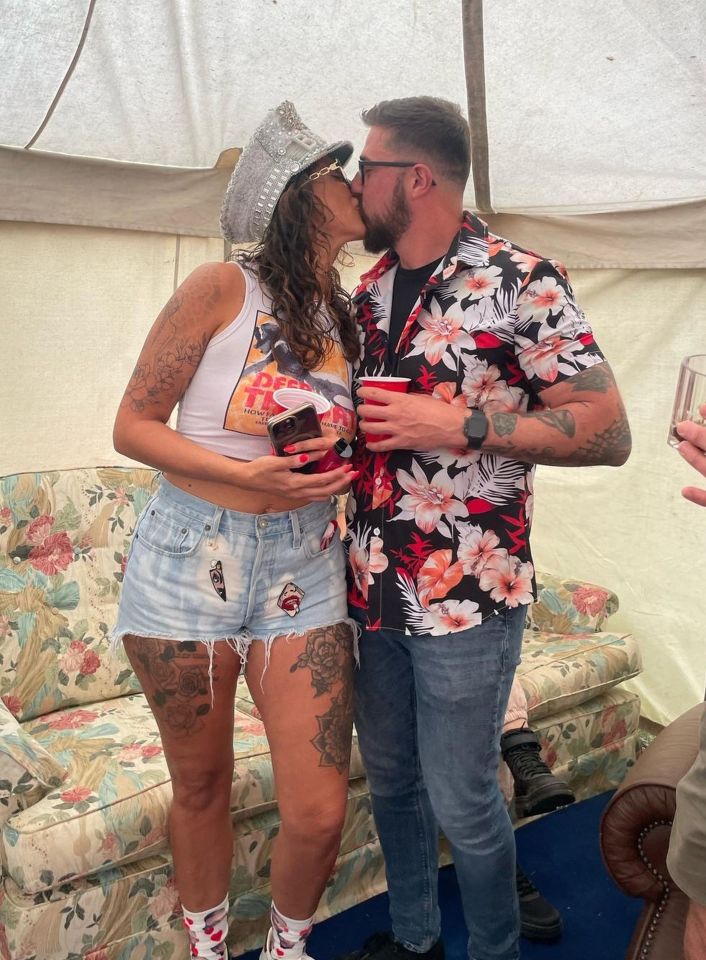 Newlyweds kissing.