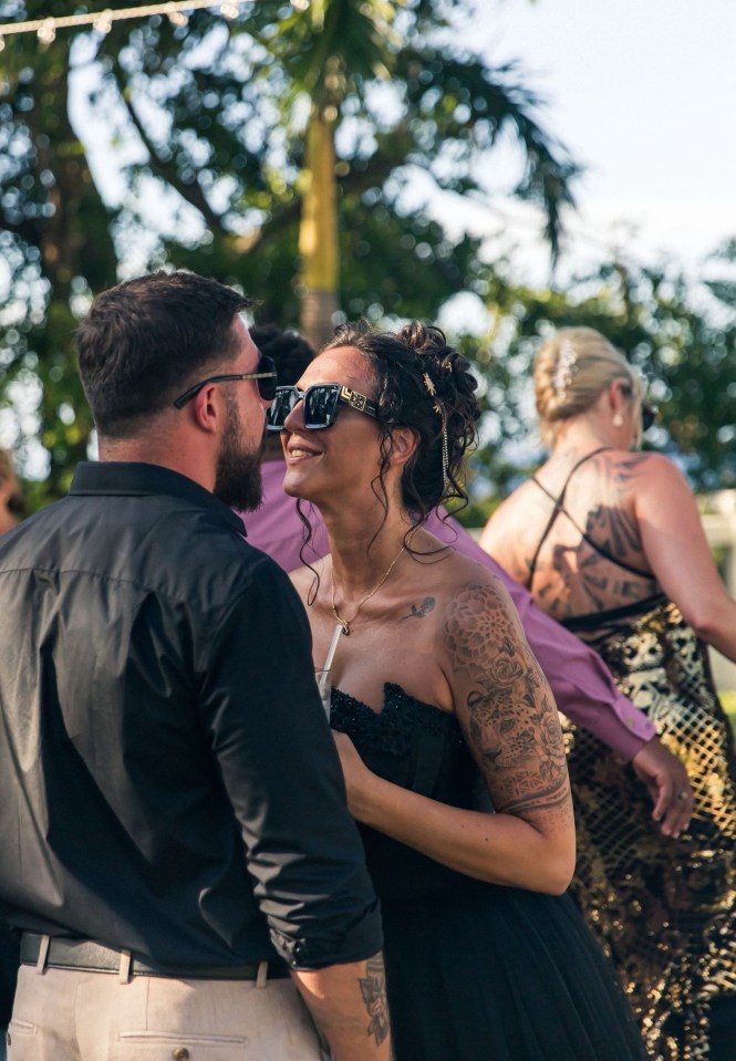 Newlyweds embracing at their wedding.