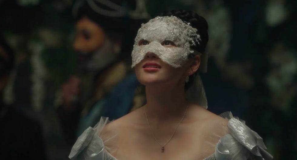yerin ha in a silver dress and regal mask in bridgerton season 4