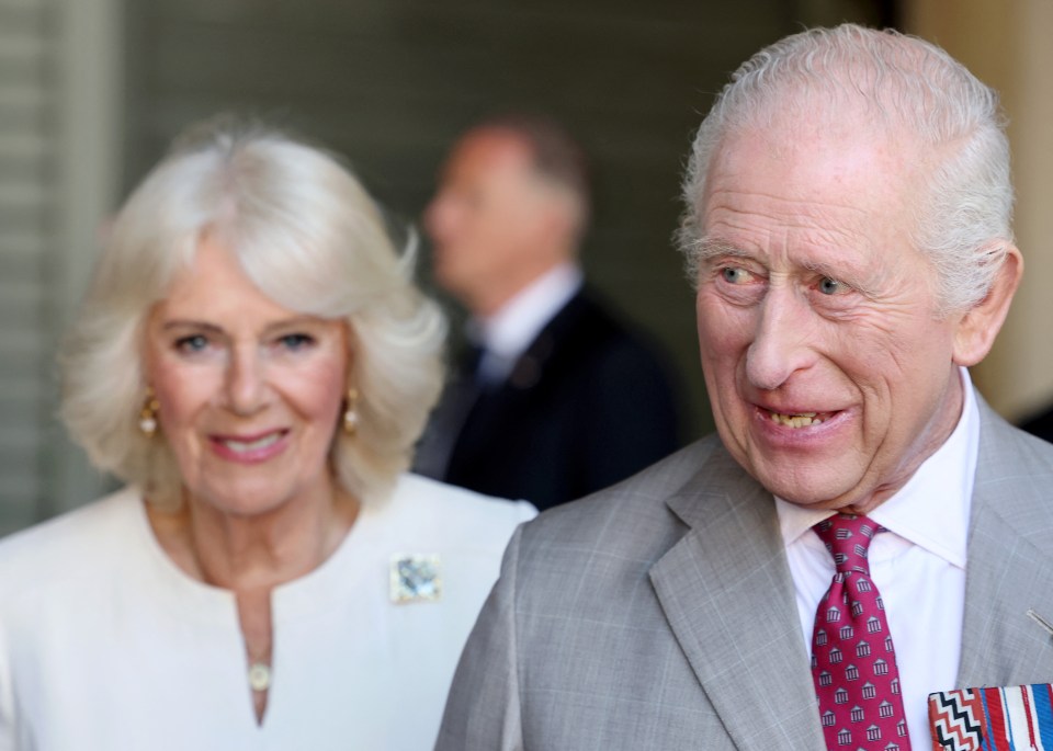 King Charles III and Queen Camilla visiting a market.