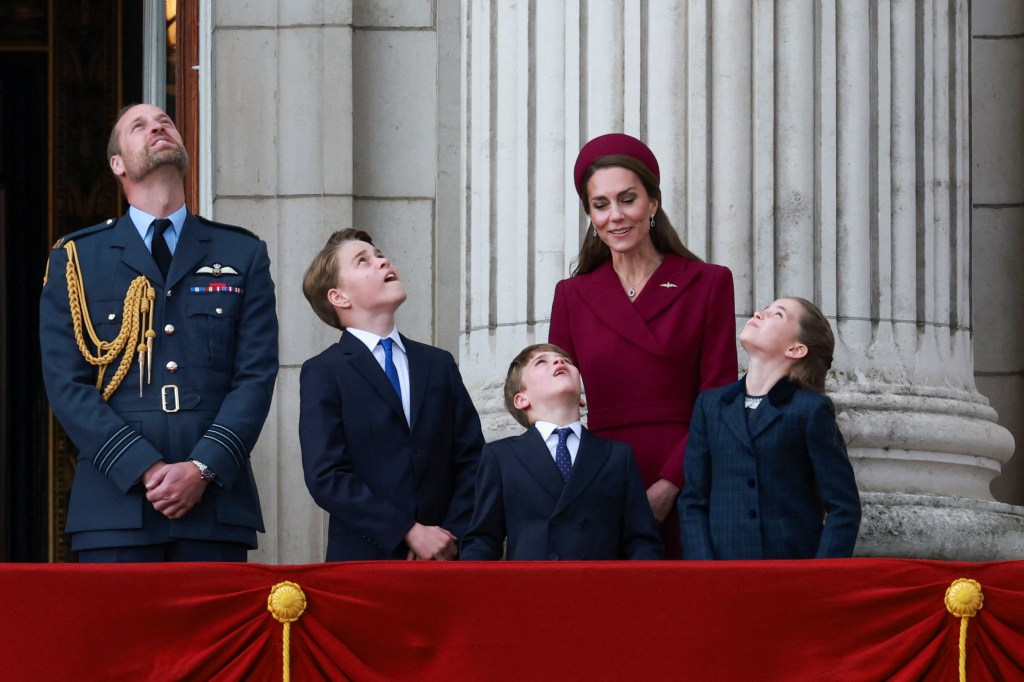 Kate Middleton, Prince William, Prince George, Prince Louis and Princess Charlotte watch the flypast.