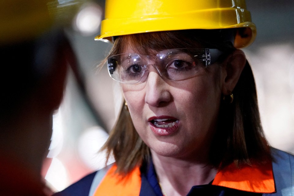 Rachel Reeves, British Chancellor of the Exchequer, wearing a hard hat and safety glasses.
