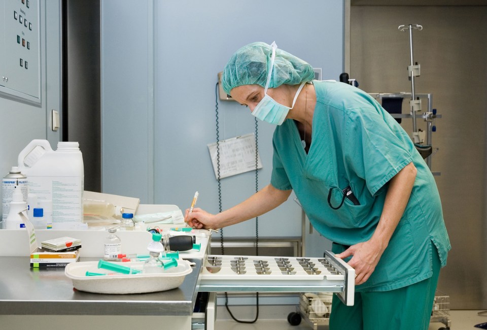 Nurse taking inventory of surgical materials.