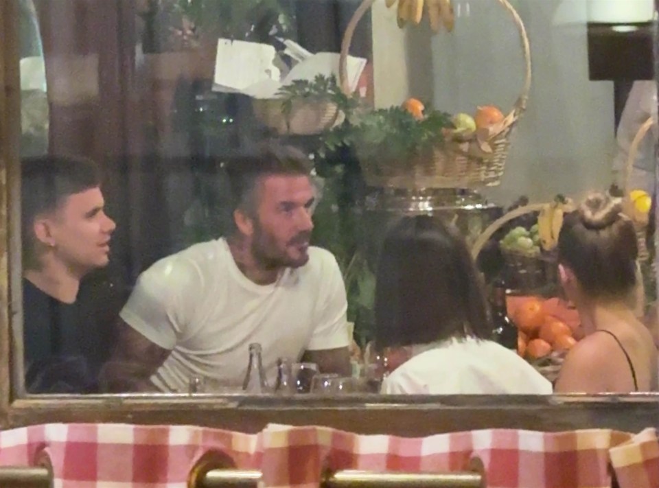 The Beckham family dining at a restaurant.