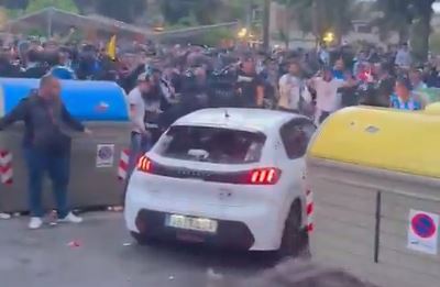 The car was surrounded by fans