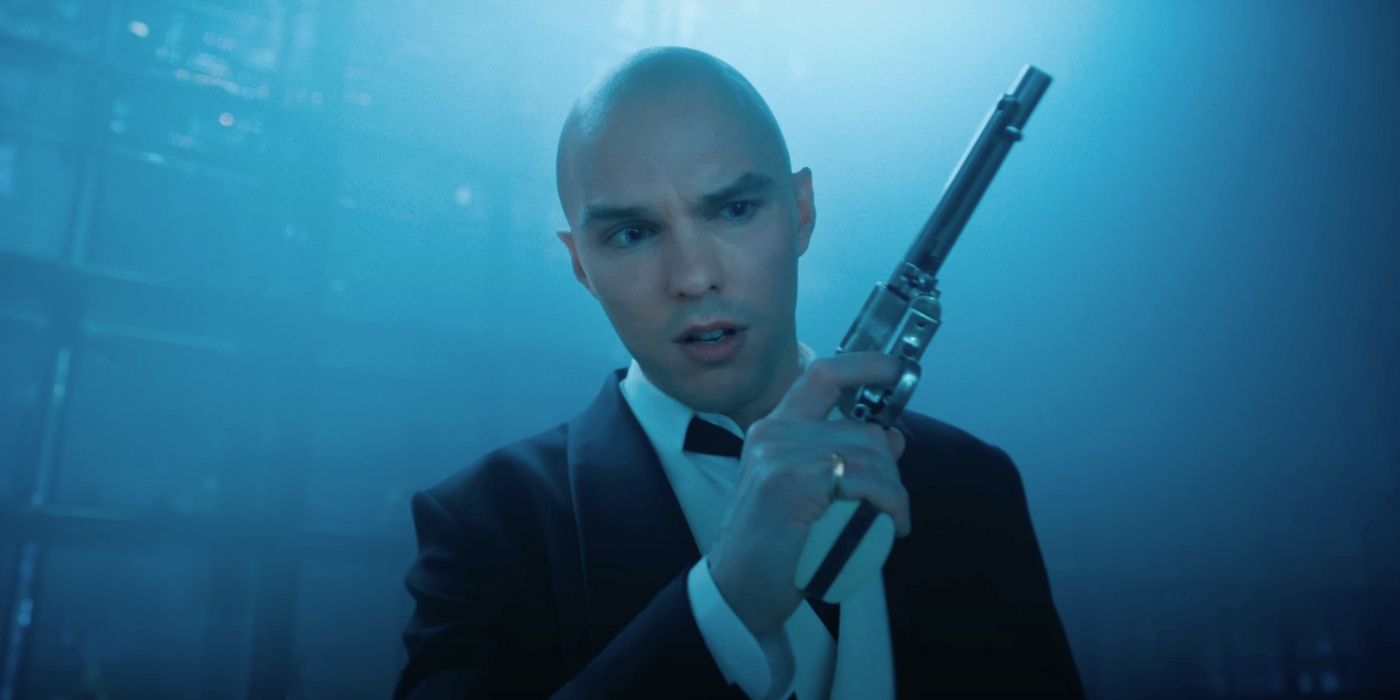 Nicholas Hoult as Lex Luthor holding a gun in Superman 