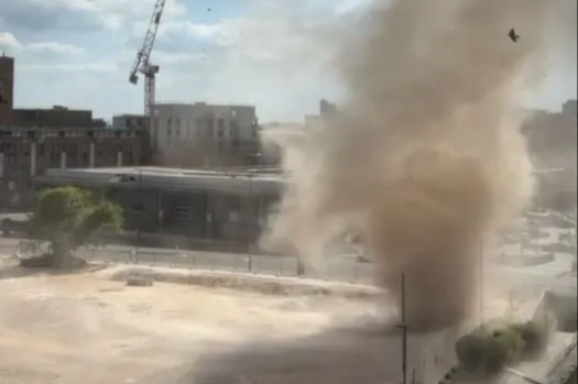 Terrifying moment 'dust DEVIL' rips through UK city centre bringing traffic to a standstill