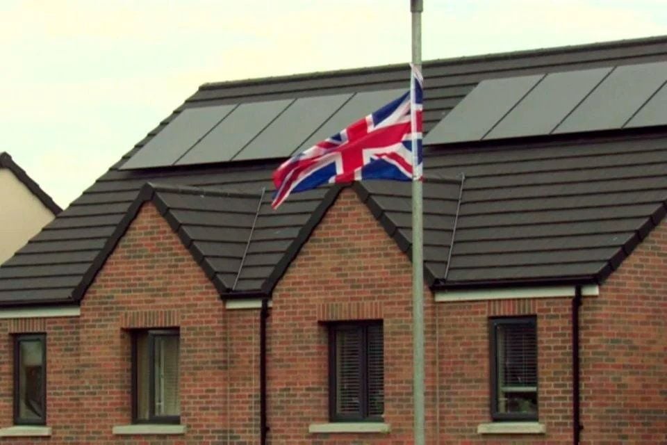 A newly-erected Union flag in the mixed Lisburn estate