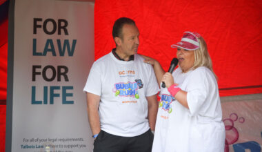 Participant enjoying the bubbles at Acorns Bubble Rush