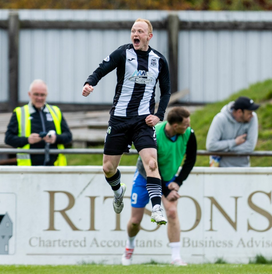 Soccer player celebrating a goal.