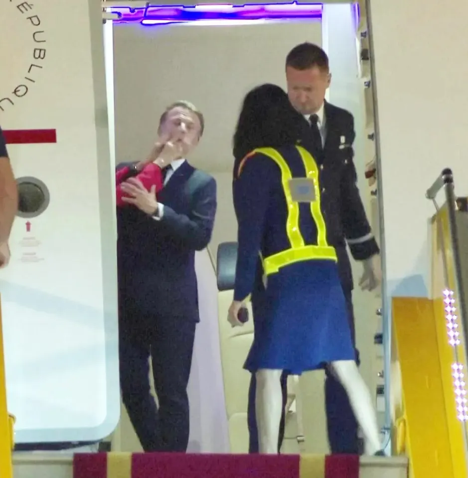 Emmanuel Macron reacting to being shoved by his wife.