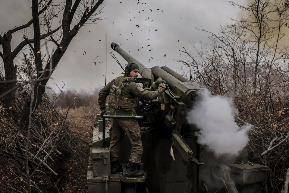 Ukrainian serviceman firing a 2S5 self-propelled howitzer.