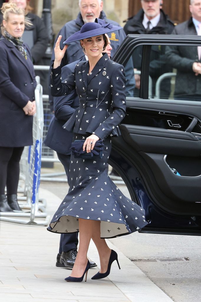 The Princess of Wales by car in navy and white skirt suit