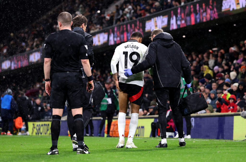 LONDON, ENGLAND - DECEMBER 05: Reiss Nelson of Fulham receives medical attention off the pitch during the Premier League match between Fulham FC and Brighton & Hove Albion FC at Craven Cottage on December 05, 2024 in London, England. (Photo by Ryan Pierse/Getty Images)