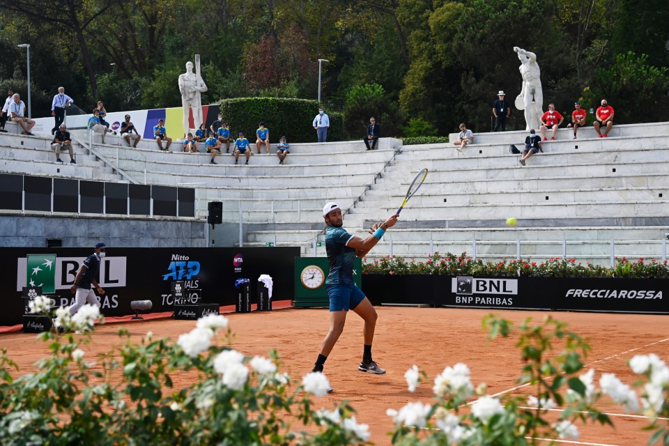 Players do battle in front of marble athletes