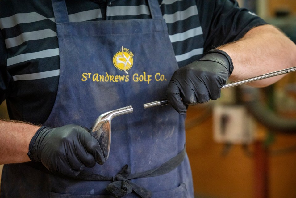 A person assembling a golf club.