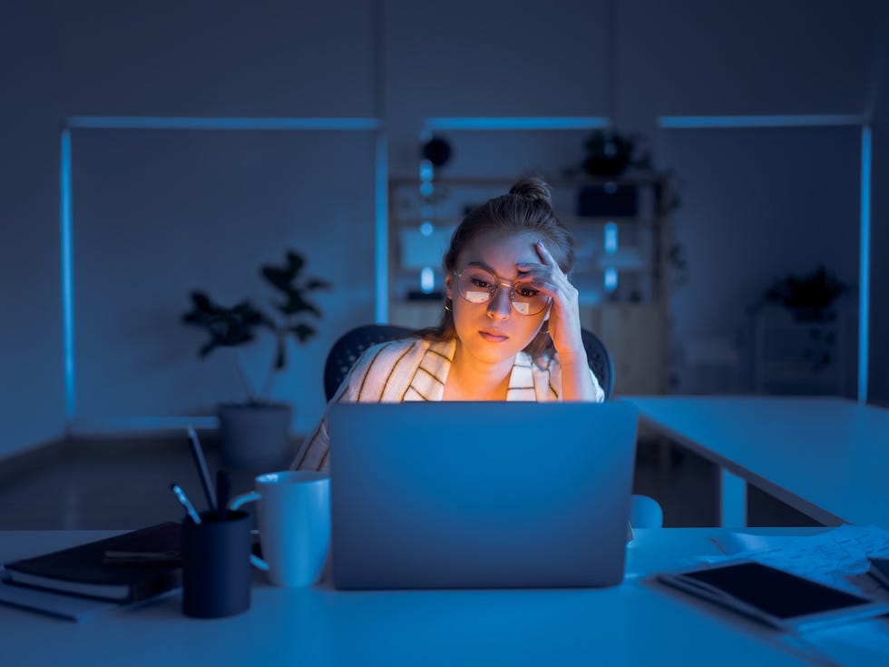 10 healthy food swaps for stress: woman working late at a computer