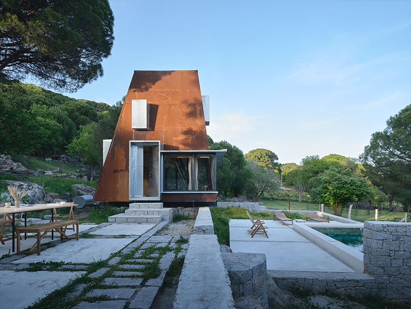 corten steel angular cabin emerges amongst pergamon forests in turkey