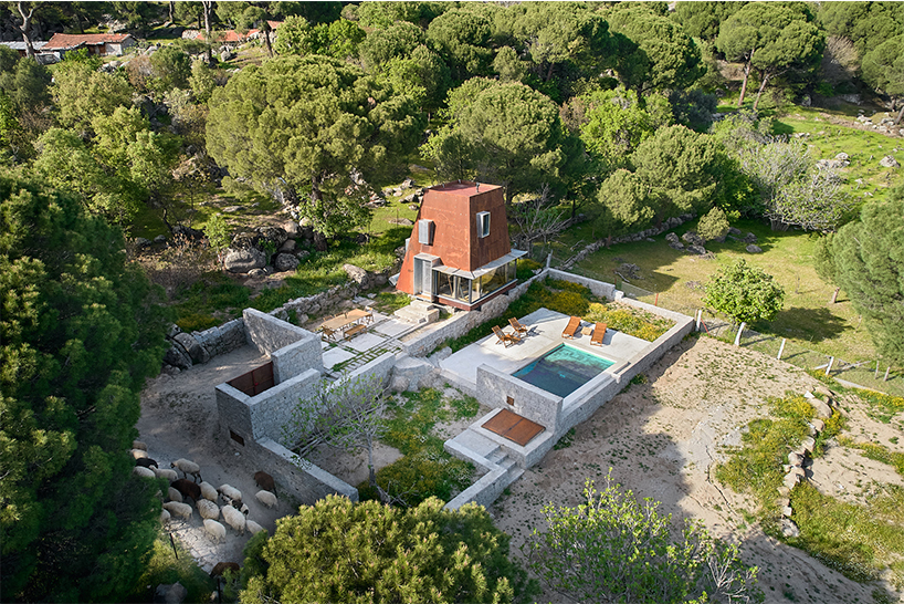 corten steel angular cabin emerges amongst pergamon forests in turkey