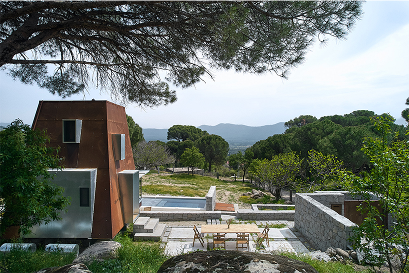 corten steel angular cabin emerges amongst pergamon forests in turkey