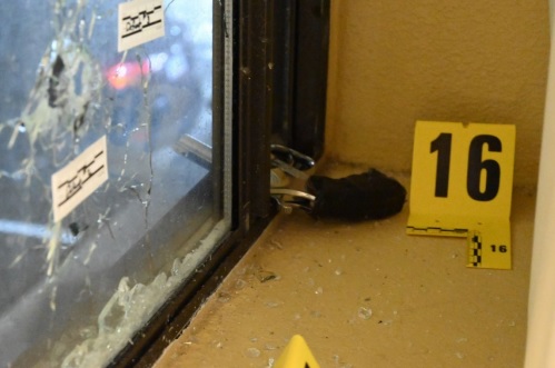 Police found a revolver partially pushed through a window where Christohper Nolan was standing behind a curtain. (Courtesy of the Connecticut Inspector General)