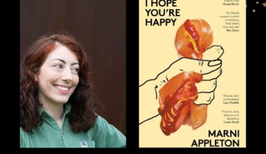Two panels. On the left is of a woman with brown wavy hair wearing a green top. She's looking to the right. On the left is the cover of a book 'I HOPE YOU'RE HAPPY'. It features an illustration of a hand squashing a hotdog.
