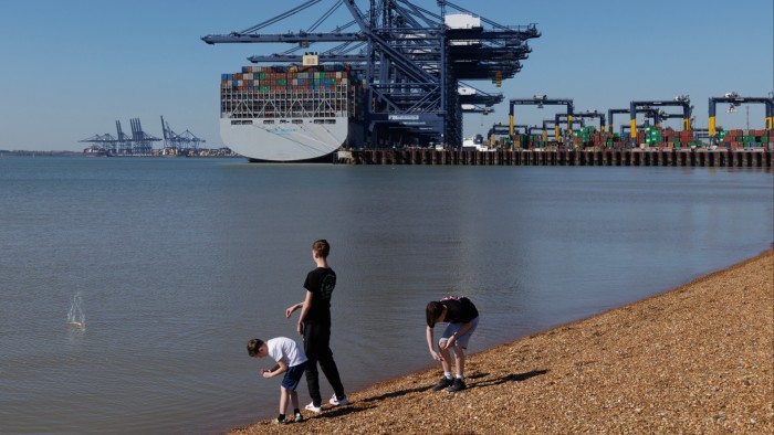 Container ships load and unload at Felixstowe Port, England