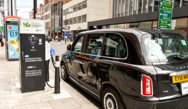 Electric London black cab connected to a rapid charging point in central London