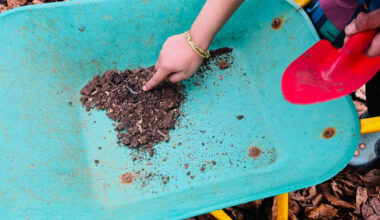 Nursery children playing with dirt
